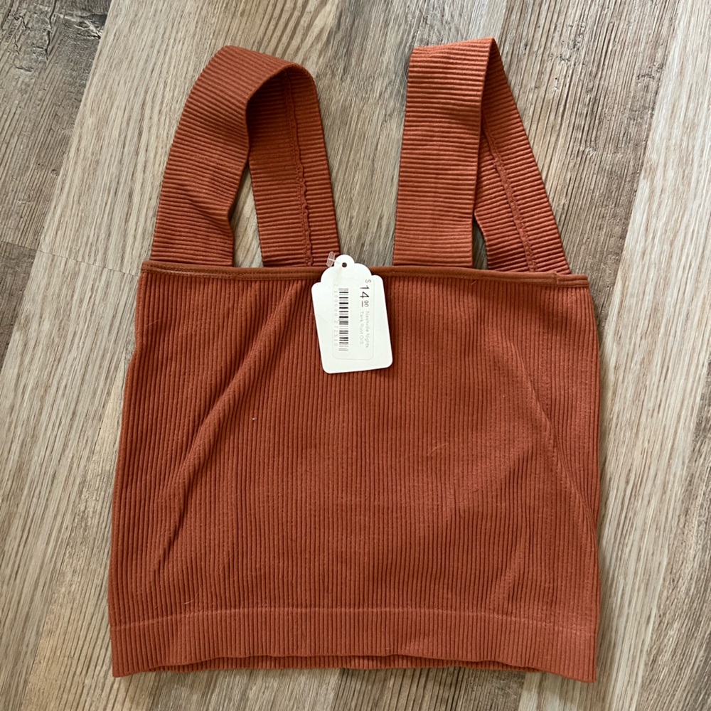 Dynamic appeal rusty orange, thick strap, crop top.